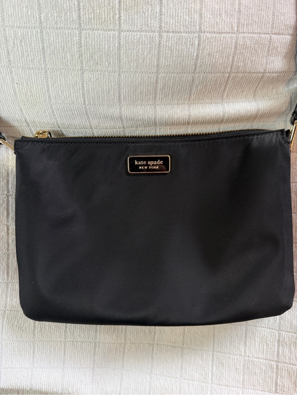 Kate Spade New York black nylon crossbody with gold accents